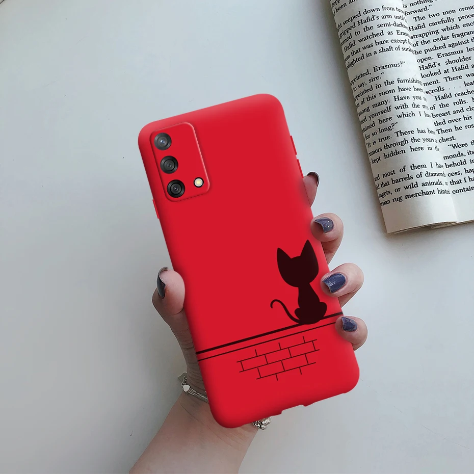 Un teléfono rojo con un gato