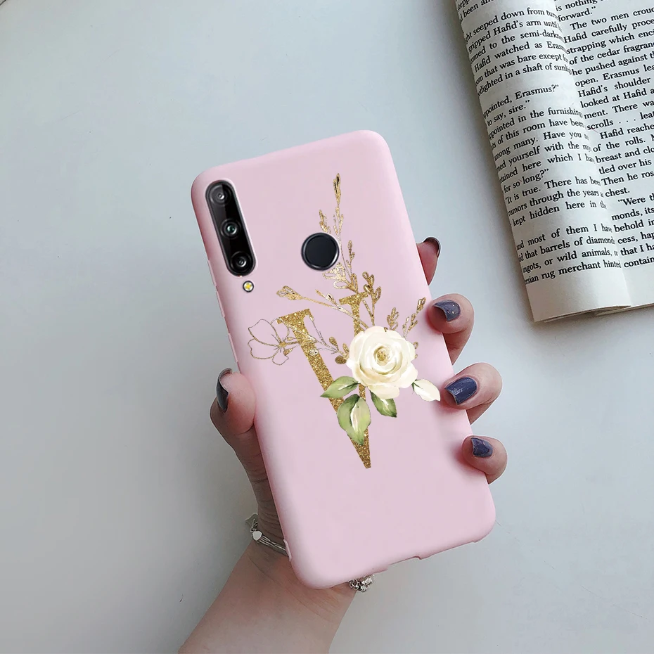 Un teléfono celular rosa con una rosa