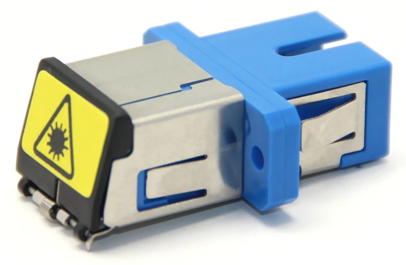 Una unidad flash azul y plateada con una pegatina de advertencia amarilla