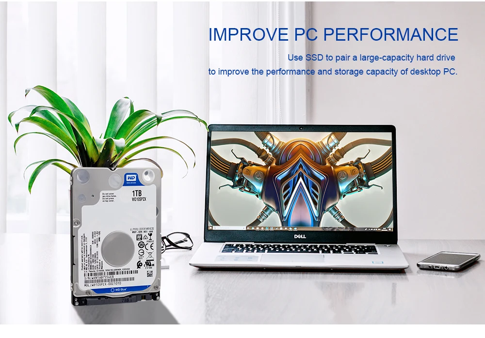 Una computadora portátil y un disco duro están en la mesa