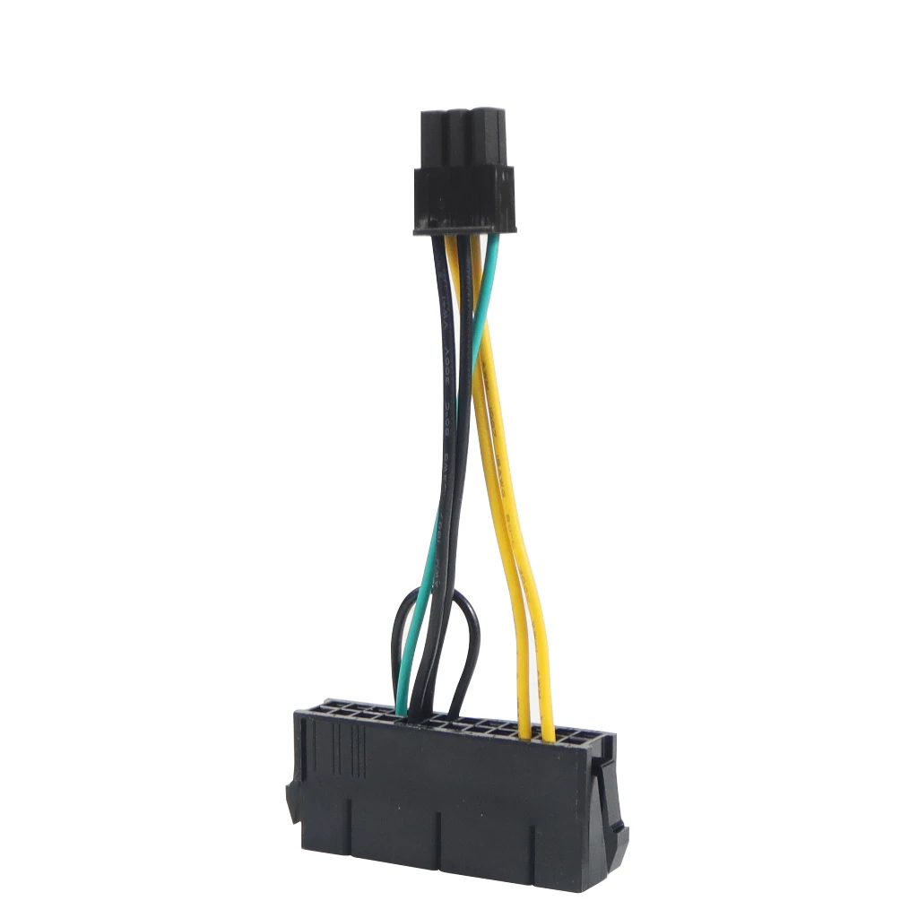 Una caja negra con cables amarillos y verdes unidos