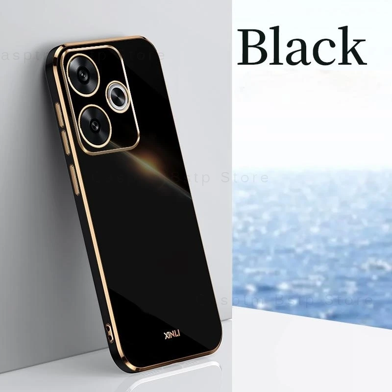 Un teléfono celular negro y dorado con una imagen del océano en el fondo