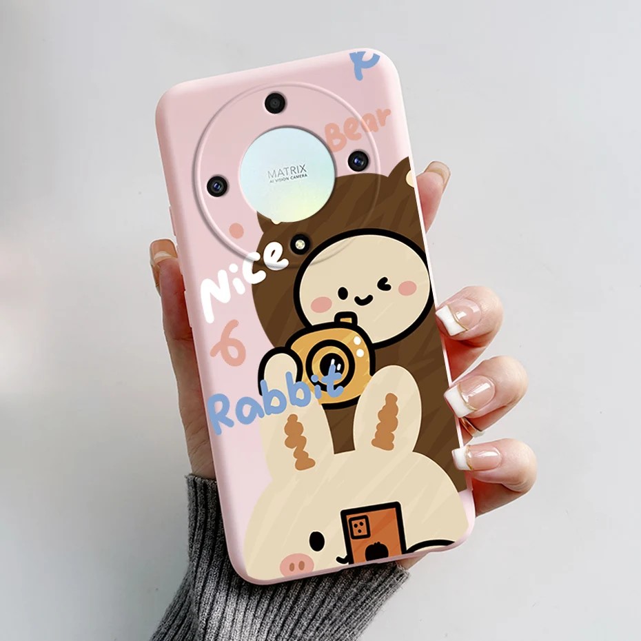 Un teléfono celular rosa con un conejo y oso