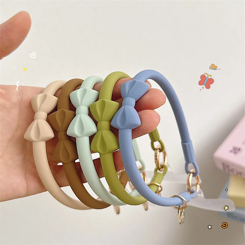 Pulsera con cordón para teléfono móvil, correa de muñeca antipérdida de silicona, estilo bonito con lazo, llave desmontable Universal con parche transparente