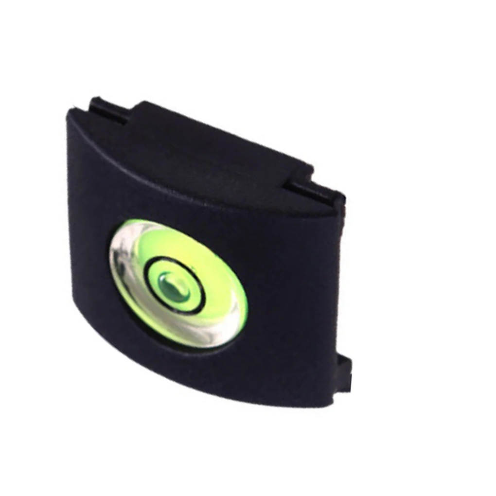 Una caja negra con un botón verde