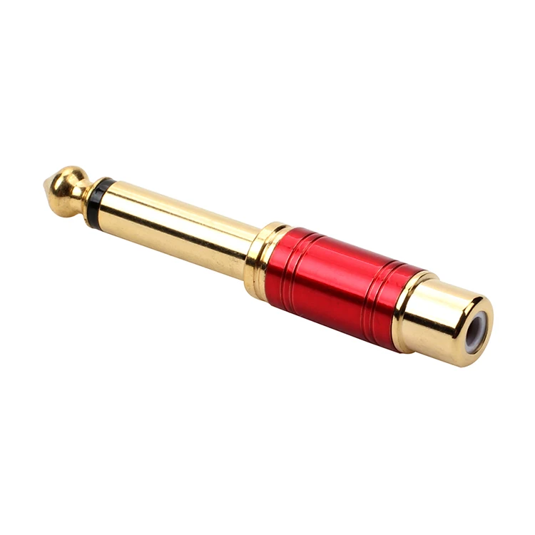 Un objeto de oro y rojo con un tornillo de oro en el extremo