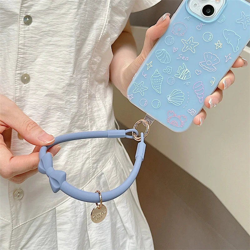 Pulsera con cordón para teléfono móvil, correa de muñeca antipérdida de silicona, estilo bonito con lazo, llave desmontable Universal con parche transparente - imagen 4