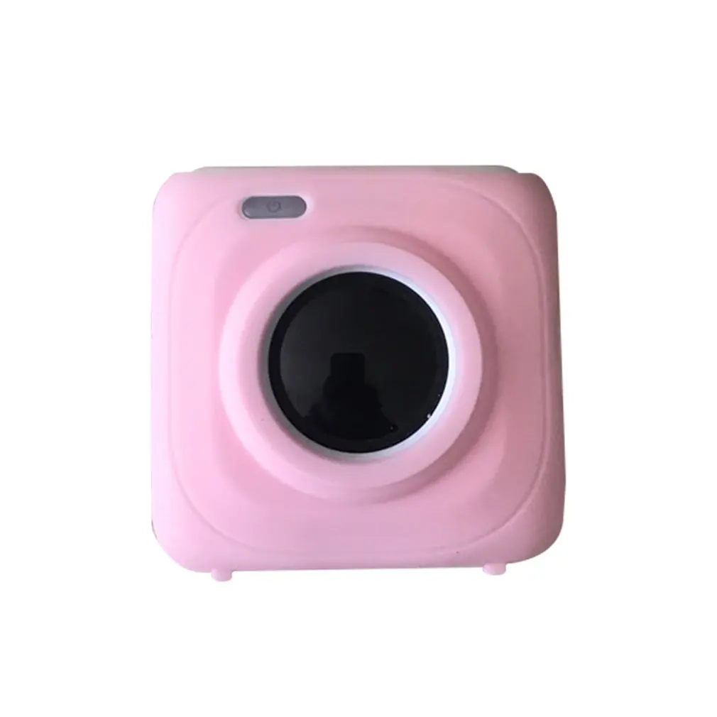 Una cámara rosa con una lente negra
