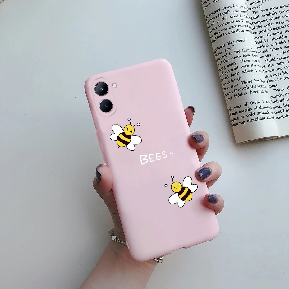 Un teléfono rosa con una pegatina de abeja