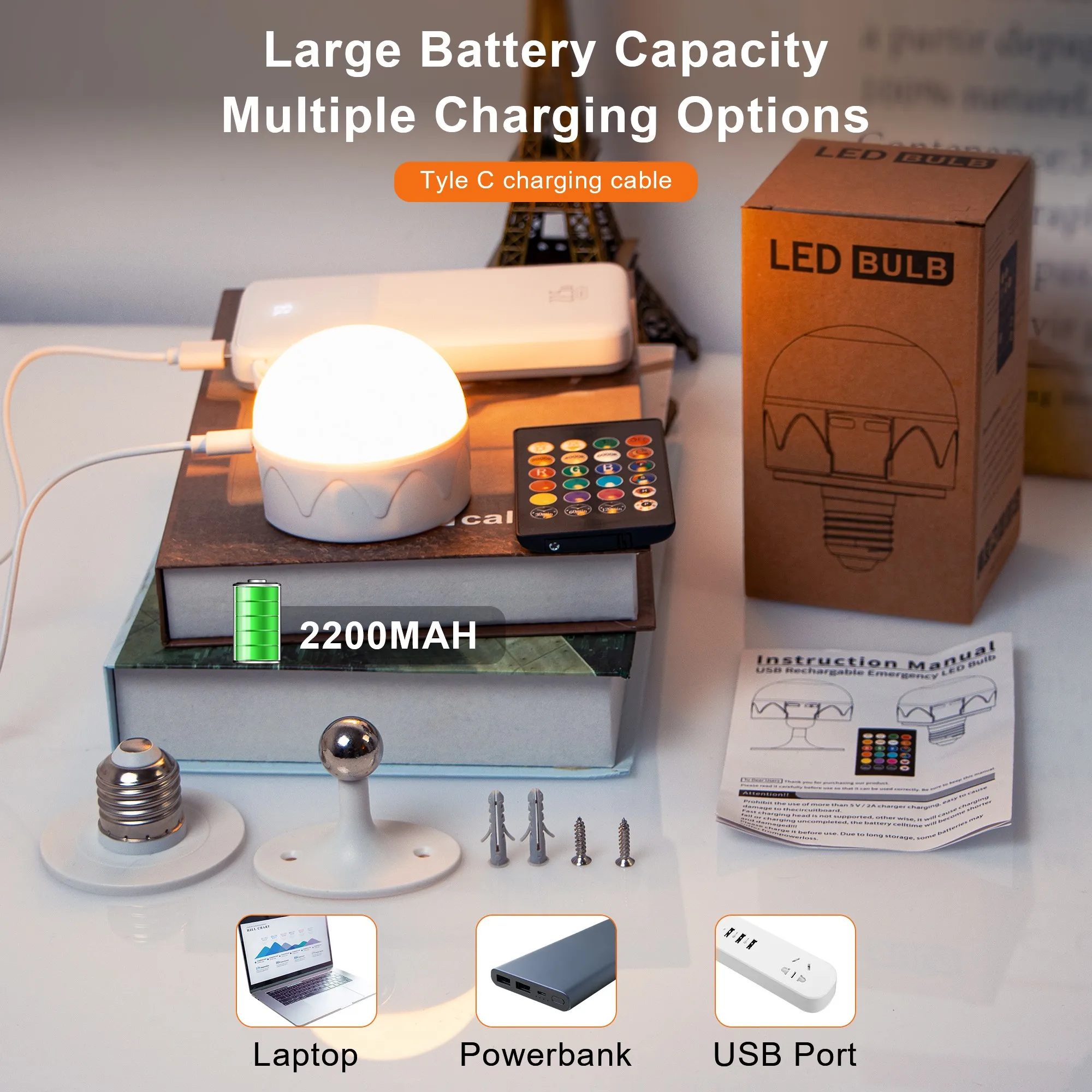 Una caja de bombillas LED y una computadora portátil con una luz