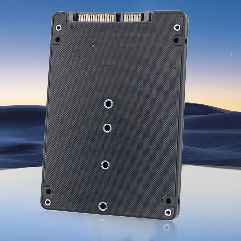 Una tableta negra con 4 hoyos en la parte posterior