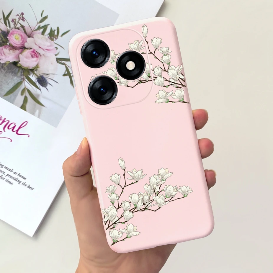 Un teléfono celular rosa con un diseño floral