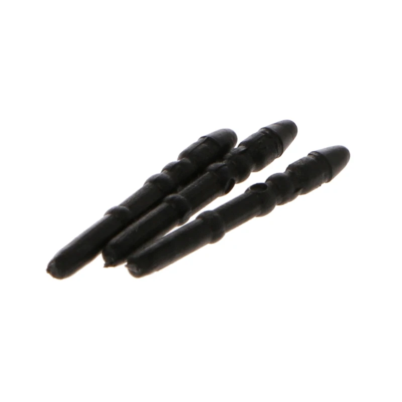 Un grupo de cuatro objetos de plástico negro