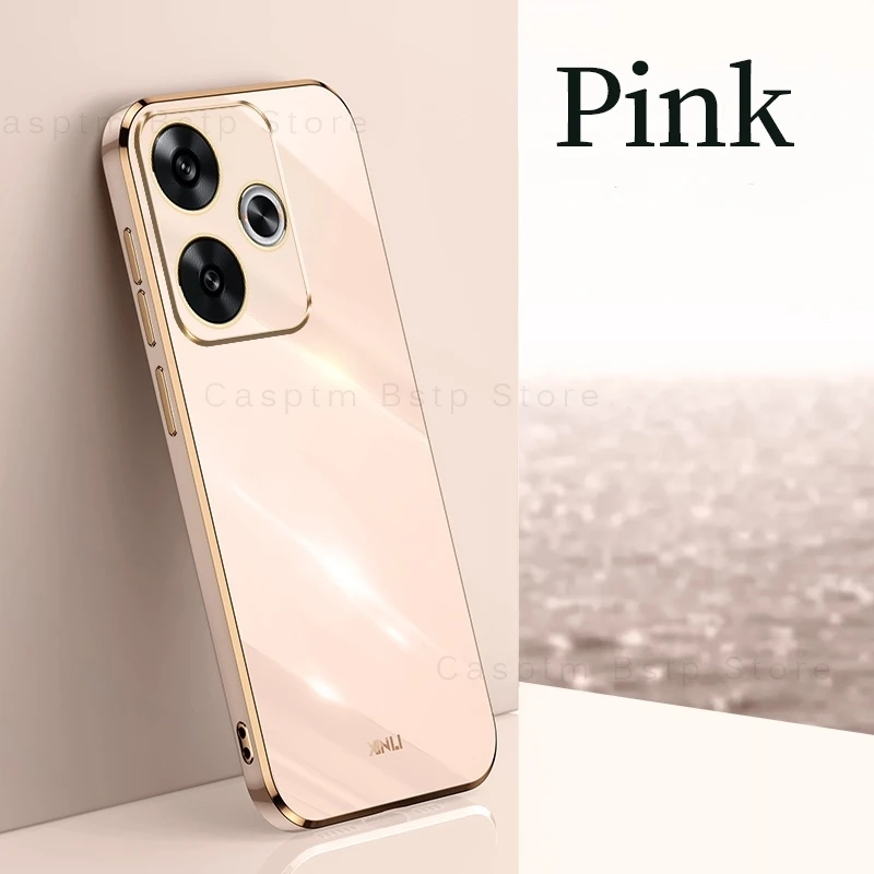 Un teléfono celular rosa con una caja dorada