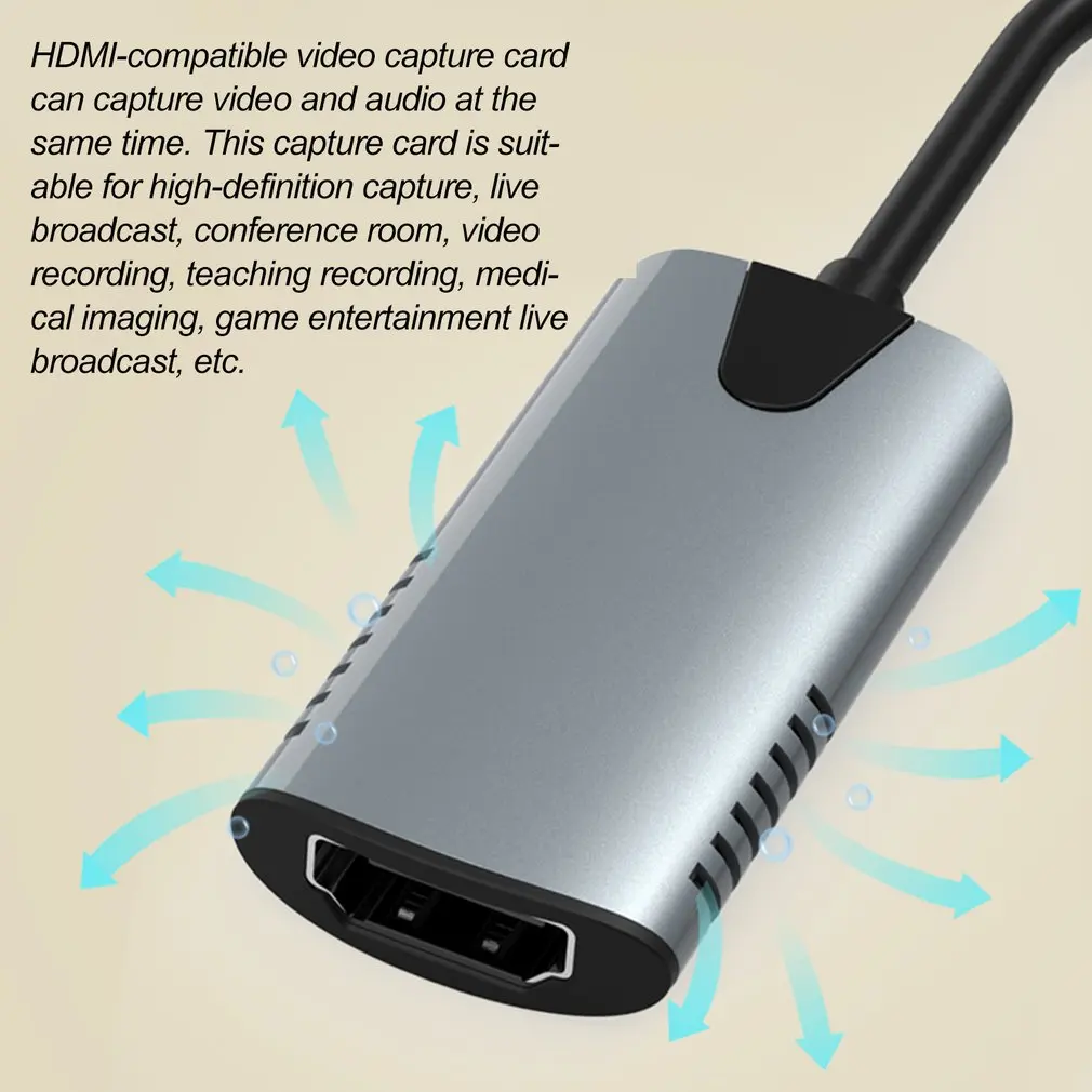 Un dispositivo de captura de video plateado con un cable negro