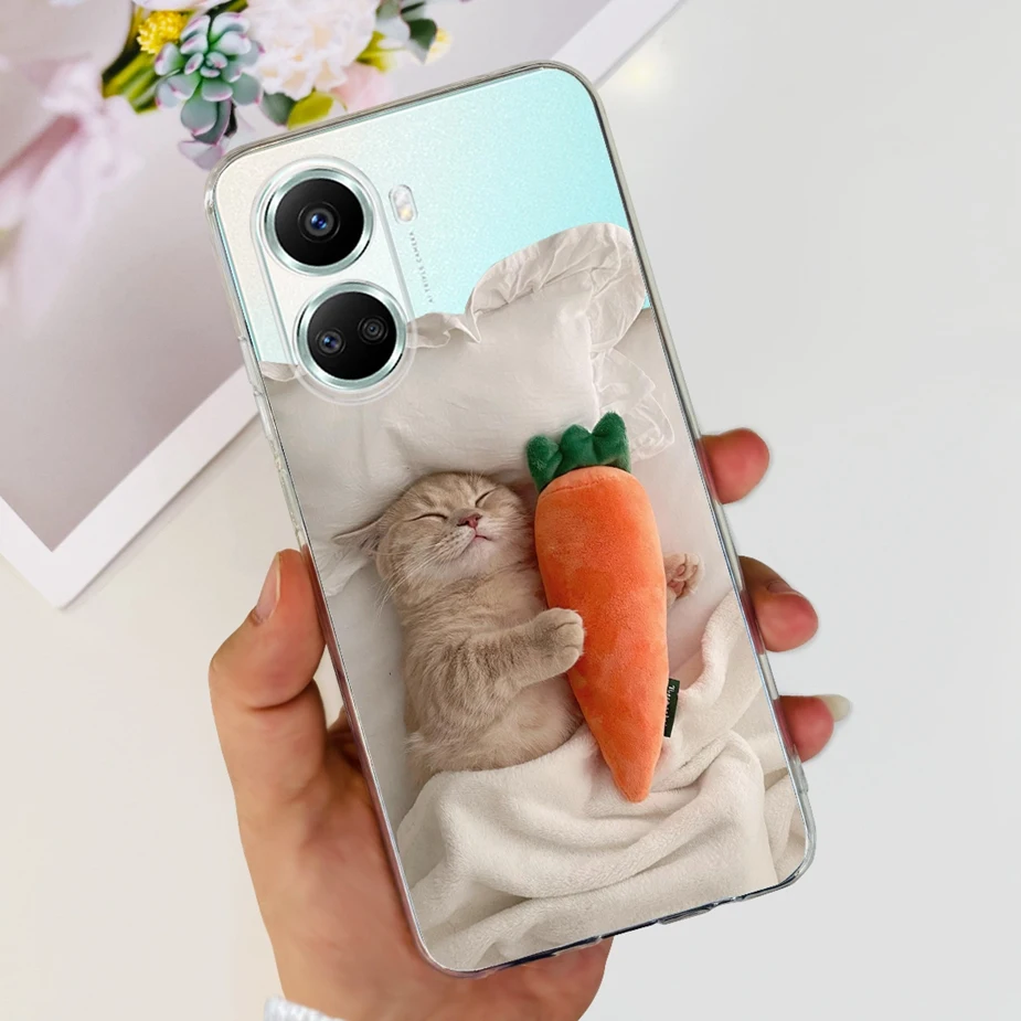 Una persona que sostiene un teléfono celular con un gato y zanahoria en la pantalla