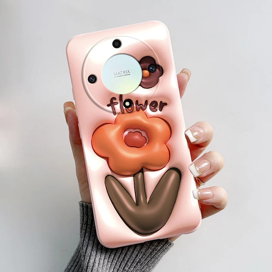 Un teléfono celular rosa con una caja de flores