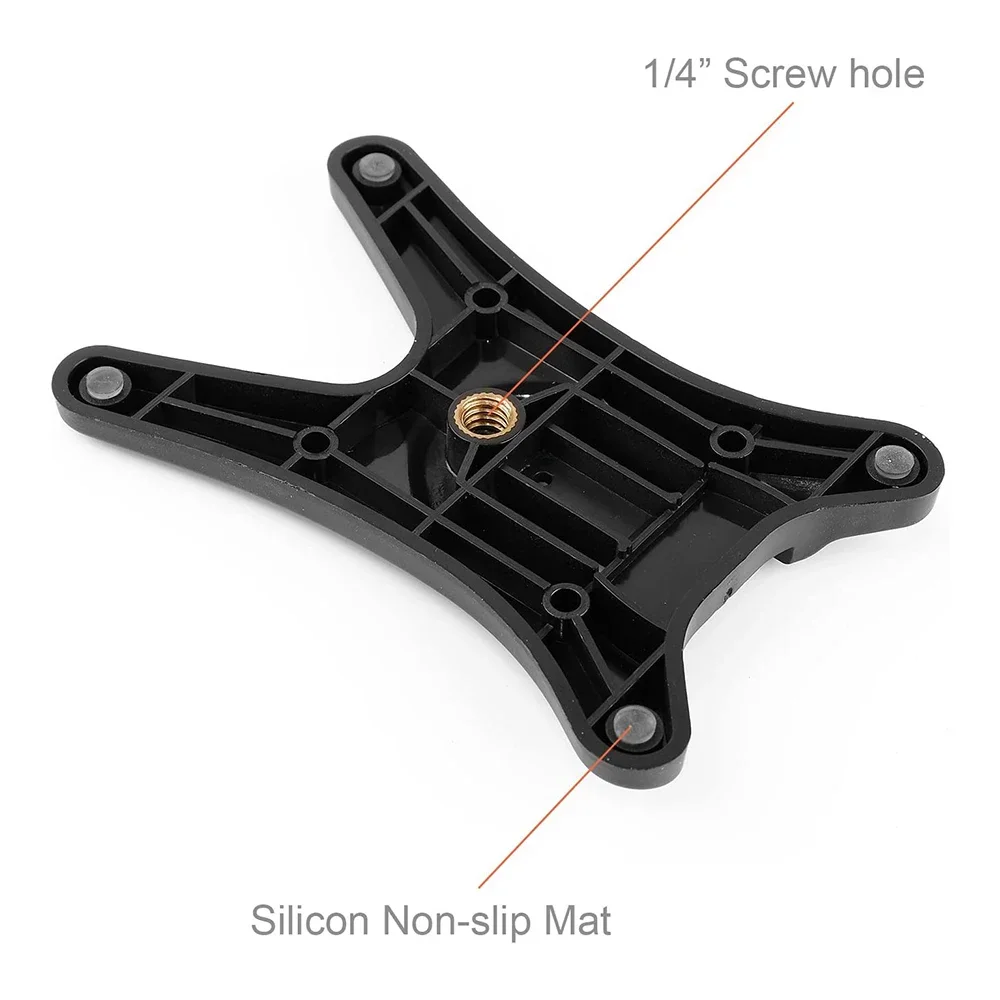 Una pieza de plástico negro con un orificio de tornillo en el centro