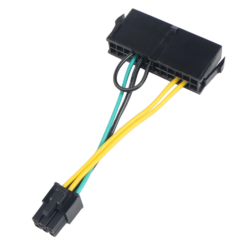 Una caja negra con cables amarillos y verdes unidos