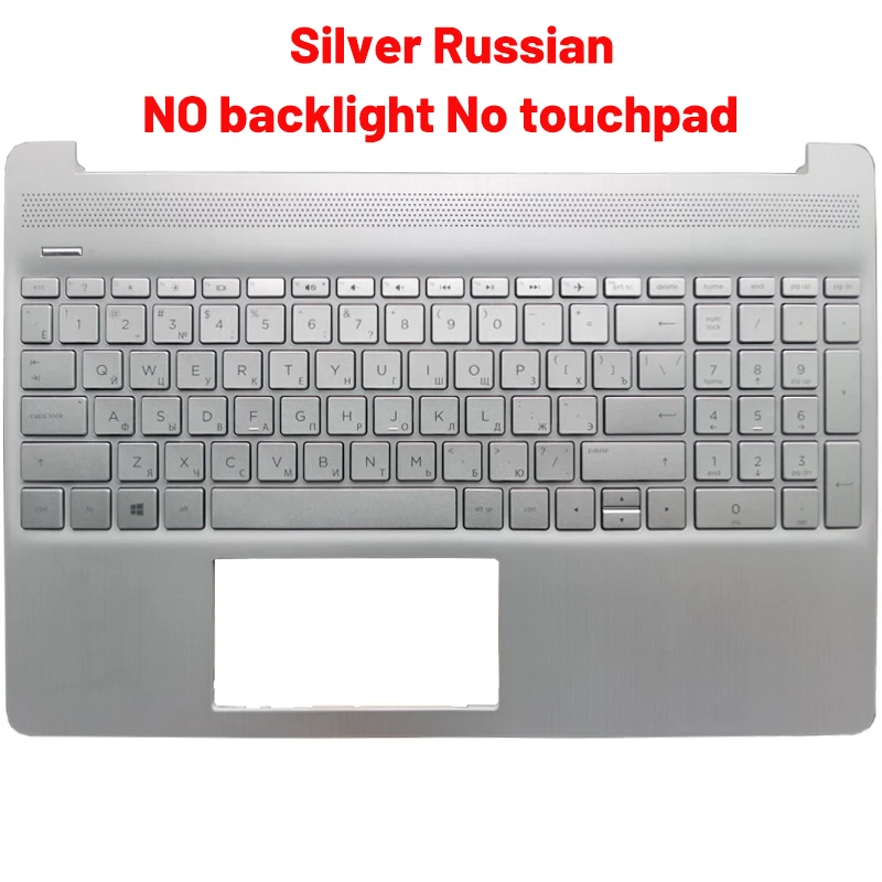 Un teclado plateado sin luz de fondo y panel táctil