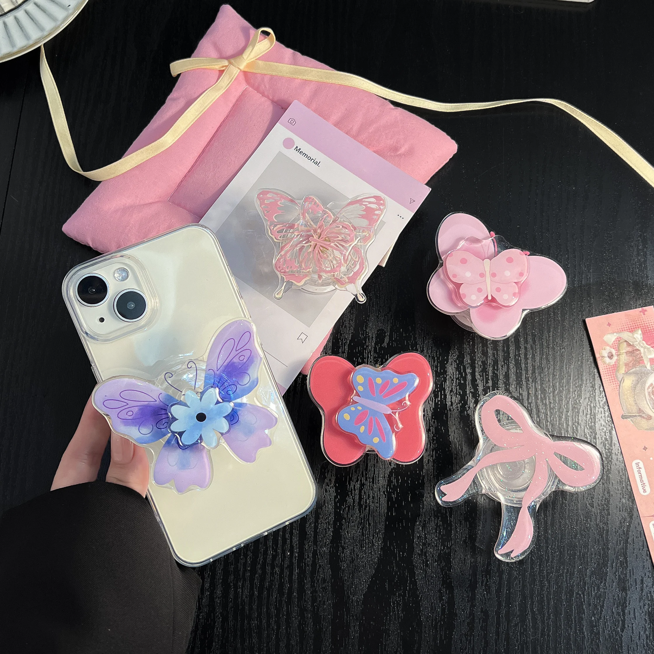 Soporte acrílico para teléfono con nudo de mariposa, soporte para enchufe, accesorios de moda para teléfono móvil, funda para Apple, Huawei, Xiaomi y Samsung