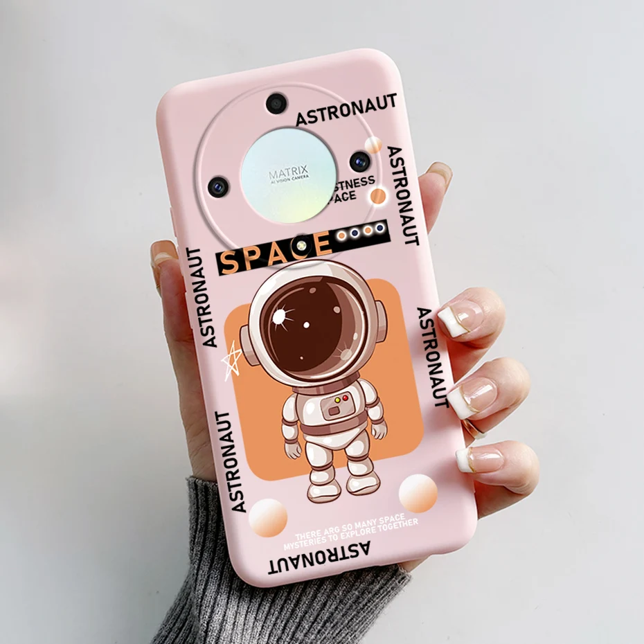 Una caja de teléfono rosa con un astronauta