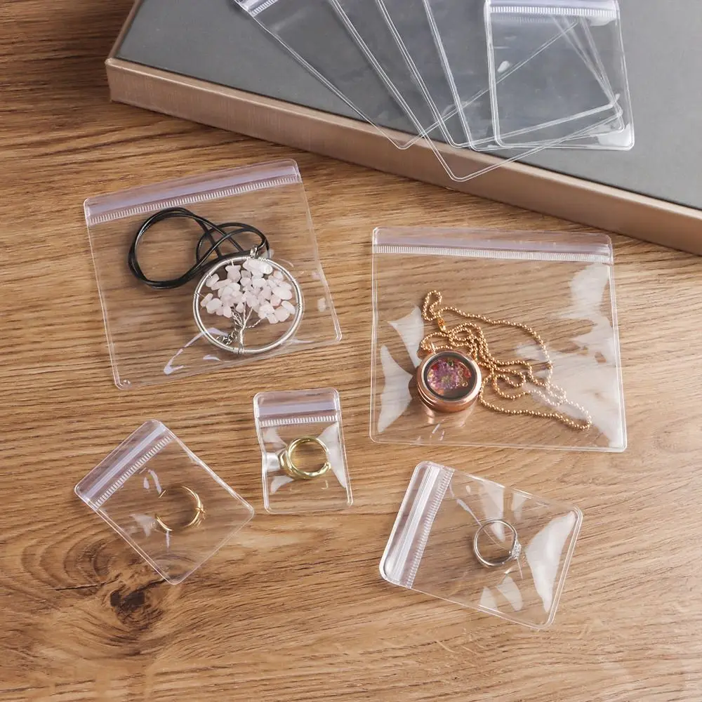 100 Uds. Bolsa autosellante de plástico PVC bolsas transparentes a prueba de polvo con cierre de cremallera bolsa de joyería resellable bolsas de almacenamiento de embalaje de regalo - imagen 5
