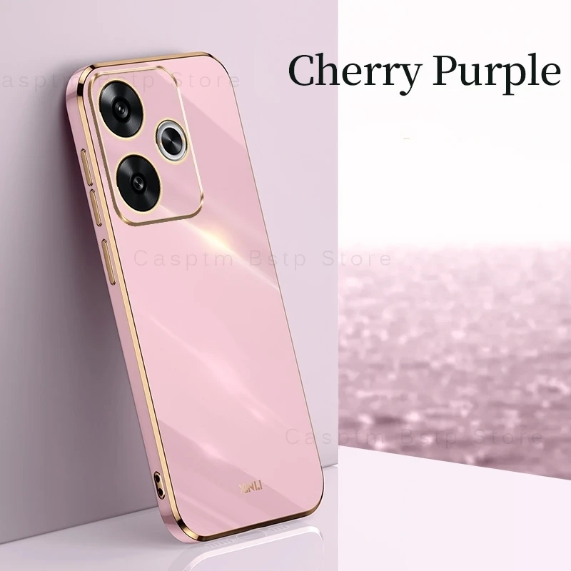 Un teléfono celular rosa con un adorno dorado