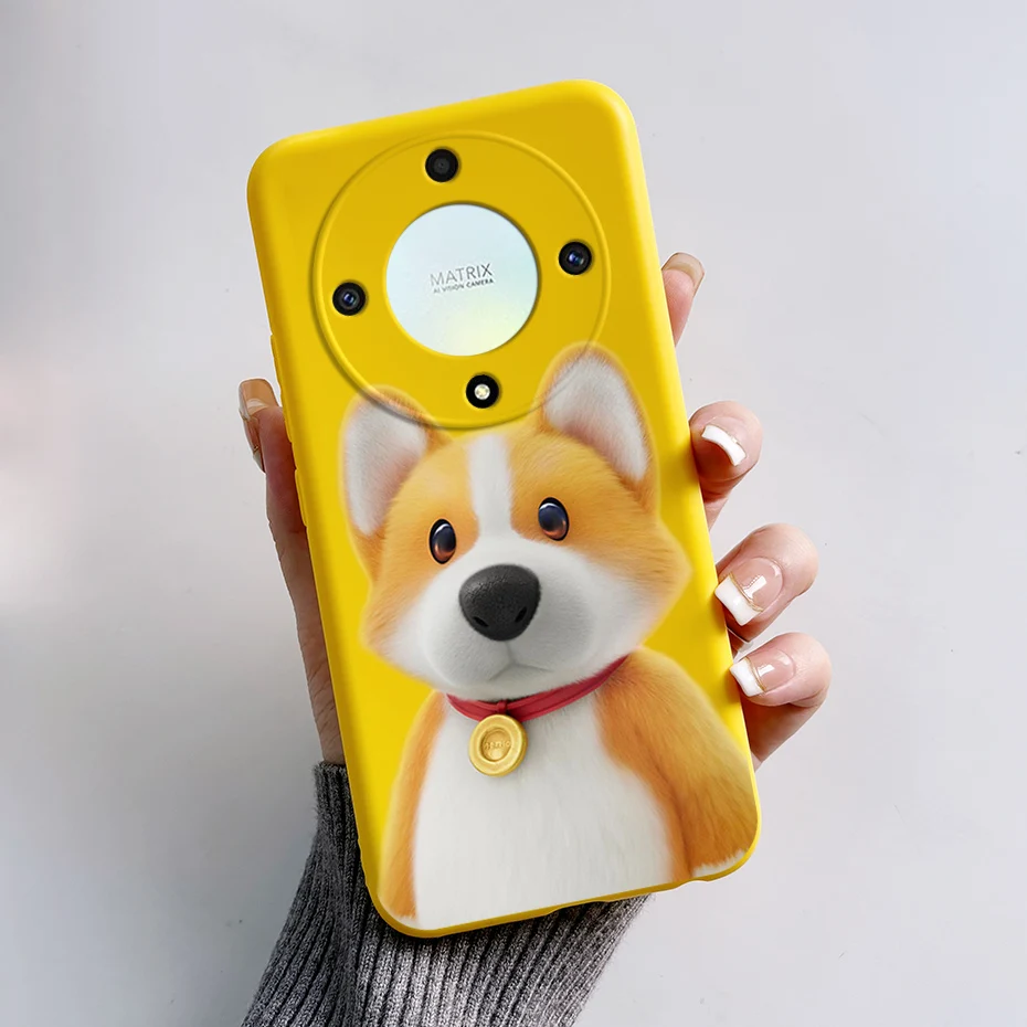 Un teléfono celular amarillo con un perro en el frente