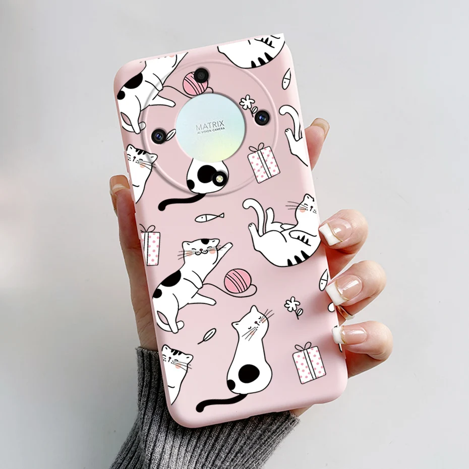 Una caja de teléfono rosa con gatos