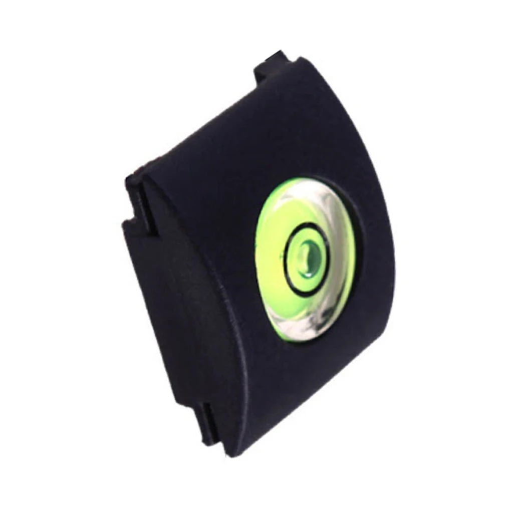 Un estuche negro con un círculo verde