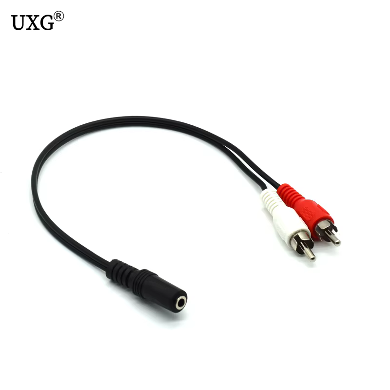 Vista frontal del adaptador UXG mostrando el conector de 3,5 mm hembra y los dos RCA macho