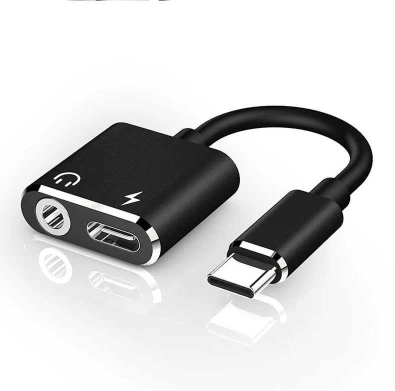 Adaptador en color negro sobre superficie