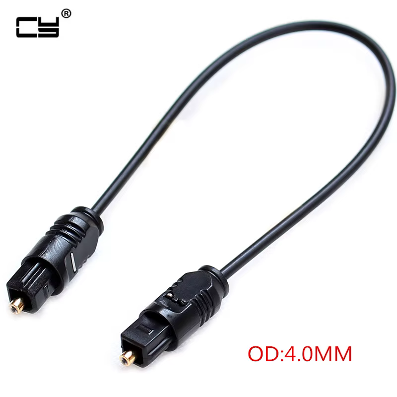 Cable TOSLINK 20 cm en configuración de escritorio con PC y altavoces