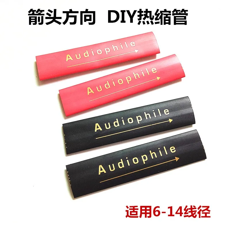 Tubo termorretráctil negro y rojo sobre cable de altavoz