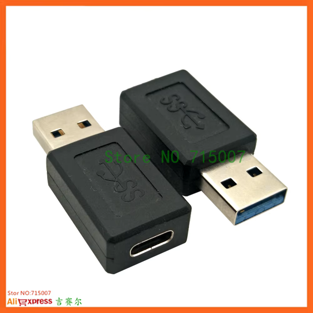 Adaptador junto a un disco duro portátil y una memoria USB