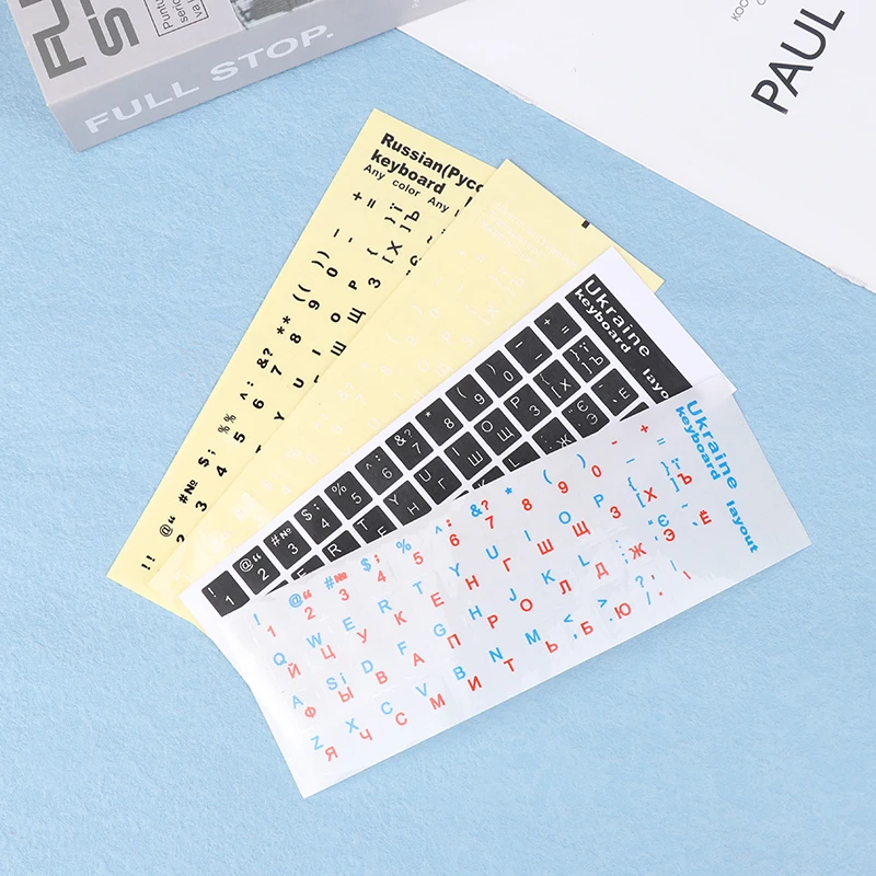 Pegatina de teclado ucraniano con fondo negro/transparente y letras blancas/azules y rojas